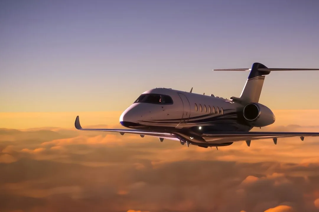 Business jet in flight at last light